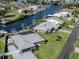 Aerial view of a waterfront home with pool and dock at 1503 Marlin St, Nokomis, FL 34275