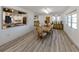 Formal dining room with wood floors, elegant chandelier, buffet, and chairs at 1503 Marlin St, Nokomis, FL 34275