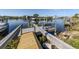 Private boat dock with access to the waterway and scenic views of the surrounding landscape at 1503 Marlin St, Nokomis, FL 34275