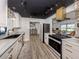 Renovated kitchen boasting stainless steel appliances, chic hardware, and custom cabinetry at 1503 Marlin St, Nokomis, FL 34275