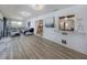 Bright and open living room featuring new flooring, modern lighting, and comfortable seating at 1503 Marlin St, Nokomis, FL 34275
