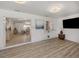 Open concept living room showcasing new flooring and pass-through to dining area at 1503 Marlin St, Nokomis, FL 34275
