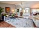 Open living area with vaulted ceilings, neutral walls, stylish rug, and double-door entry at 1611 Valley Dr, Venice, FL 34292