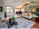 Inviting living room showcases soaring ceilings, a stylish rug, and a direct view into the dining room at 1611 Valley Dr, Venice, FL 34292