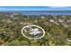 Aerial view of the home showcasing the backyard pool and lush surroundings at 1657 Bayshore Dr, Englewood, FL 34223