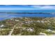 Aerial view of the property, showcasing its location near the waterfront at 1657 Bayshore Dr, Englewood, FL 34223