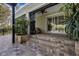 Stone steps lead to a backyard oasis, complete with patio and landscaping at 1657 Bayshore Dr, Englewood, FL 34223