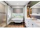 Bright bathroom featuring a freestanding tub, modern vanity, and separate shower with glass door at 1657 Bayshore Dr, Englewood, FL 34223