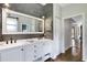 Stylish bathroom featuring dual sinks, ample counter space, wood accents, and modern lighting at 1657 Bayshore Dr, Englewood, FL 34223