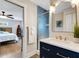 Bathroom with blue tiled shower and vanity at 1657 Bayshore Dr, Englewood, FL 34223