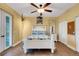 Charming bedroom with coastal decor, white furniture, ceiling fan and hardwood flooring at 1657 Bayshore Dr, Englewood, FL 34223