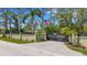 Grand gated entrance with an American flag at 1657 Bayshore Dr, Englewood, FL 34223
