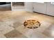 Beautiful tile flooring design featuring a compass rose mosaic at the entrance, adding a unique and nautical touch at 1657 Bayshore Dr, Englewood, FL 34223