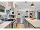 Open-concept kitchen features modern appliances, custom cabinets, and a view of the dining area for seamless entertaining at 1657 Bayshore Dr, Englewood, FL 34223