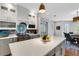 Well-appointed kitchen with custom cabinetry, stainless steel appliances, and a large island for meal preparation and casual dining at 1657 Bayshore Dr, Englewood, FL 34223