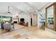 Comfortable living room with a fireplace, ceiling fan, and neutral decor at 1657 Bayshore Dr, Englewood, FL 34223