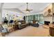 An open concept living room featuring high ceilings, a fireplace, and a large kitchen island at 1657 Bayshore Dr, Englewood, FL 34223