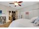 This main bedroom features a walk-in closet and a view of the ensuite bathroom at 1657 Bayshore Dr, Englewood, FL 34223