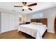 Bright main bedroom with hardwood floors, ceiling fan, and natural light at 1657 Bayshore Dr, Englewood, FL 34223