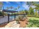 Pool view with covered patio and outdoor dining, lush perimeter landscaping and fencing at 1657 Bayshore Dr, Englewood, FL 34223