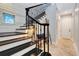 Staircase with decorative railing and a cozy decorative bench at 1657 Bayshore Dr, Englewood, FL 34223