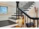 Staircase with decorative railing and a cozy decorative bench at 1657 Bayshore Dr, Englewood, FL 34223