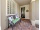 Cozy front porch with comfortable seating, decorative pillows, and a view of the home's entryway at 177 Treviso Ct, North Venice, FL 34275