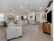 Bright, open-plan living room with modern furnishings and neutral decor with easy access to the kitchen and dining areas at 177 Treviso Ct, North Venice, FL 34275
