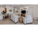 Stylish living room with modern decor, a large television, and an inviting atmosphere for relaxation at 177 Treviso Ct, North Venice, FL 34275