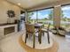 Screened in patio featuring a complete outdoor kitchen and dining area at 177 Treviso Ct, North Venice, FL 34275