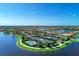 Community aerial view featuring tennis courts, swimming pools and community lakes at 19124 Mangieri St, Venice, FL 34293
