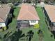 Aerial view of a home with a screened-in lanai and manicured lawn, offering a serene outdoor space at 19124 Mangieri St, Venice, FL 34293