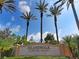 Elegant entrance sign for IslandWalk at the West Villages, surrounded by lush greenery and palm trees at 19124 Mangieri St, Venice, FL 34293