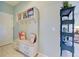 Charming entryway with a bench, storage, and decorative pillows that enhance the welcoming atmosphere at 19124 Mangieri St, Venice, FL 34293