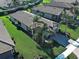 Beautiful home with lush landscaping, a paver driveway, and a well-manicured lawn at 19124 Mangieri St, Venice, FL 34293