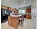 Spacious kitchen features a large island, granite countertops, and stainless steel appliances at 19124 Mangieri St, Venice, FL 34293