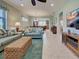 Bright living room with a dining area view, sofas, and woven storage at 19124 Mangieri St, Venice, FL 34293