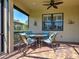 This screened patio features brick flooring and comfortable seating for outdoor enjoyment at 19124 Mangieri St, Venice, FL 34293