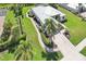 Aerial view highlighting lush landscaping and mature trees surrounding this home at 19893 Cobblestone Cir, Venice, FL 34292