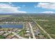 Great aerial view shows houses lining the lake and the proximity to major highways for easy access at 19893 Cobblestone Cir, Venice, FL 34292