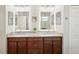 Bathroom with double vanity, granite countertop, and modern fixtures with a view to the shower at 19893 Cobblestone Cir, Venice, FL 34292