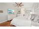 Relaxing main bedroom featuring hardwood floors, ceiling fan, and relaxing decor at 19893 Cobblestone Cir, Venice, FL 34292