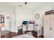 This is an office space with wood floors, a grey desk, two computer screens and a grey chair at 19893 Cobblestone Cir, Venice, FL 34292