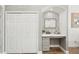 Charming office nook with decorative tile, a built in desk, and gray cabinets and drawers at 19893 Cobblestone Cir, Venice, FL 34292