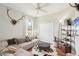 Sitting room with comfortable couch, accent furniture and decor at 19893 Cobblestone Cir, Venice, FL 34292