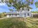 Exterior rear view of home showing the backyard and blue door at 200 Sierra S St, Nokomis, FL 34275