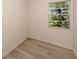 Cozy bedroom with natural light, window view and wood-look floors at 200 Sierra S St, Nokomis, FL 34275