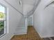 Bright foyer showcases staircase, classic tile flooring, and neutral walls at 200 Sierra S St, Nokomis, FL 34275