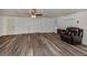 Spacious living room featuring hardwood floors and a ceiling fan at 200 Sierra S St, Nokomis, FL 34275