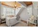 Cozy bedroom featuring a white bed, ceiling fan, and bright windows at 202 Laurel Oaks Rd, Nokomis, FL 34275